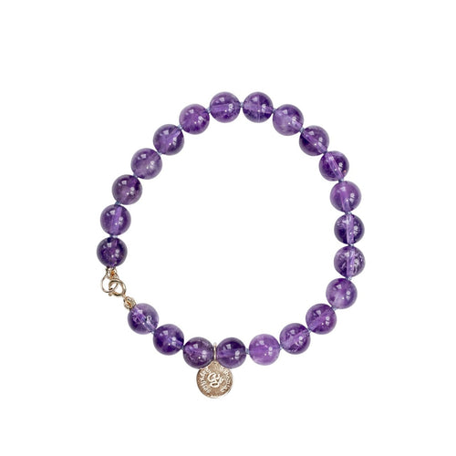 Elegant and stylish handknotted amethyst bracelet with details in 18k gold plated 925 sterling silver. Amazing high grade amethyst gemstones. Gypset style crystal bracelet.