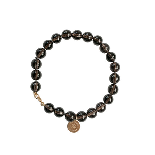Elegant and stylish hand knotted Smoky Quartz bracelet with details in 18k gold-plated 925 sterling silver and brass.