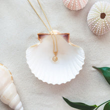 Load image into Gallery viewer, Minimalistic and stylish 42 cm long Citrine necklace with details in 18k gold-plated 925 sterling silver. Presented in a shell on a beach.

