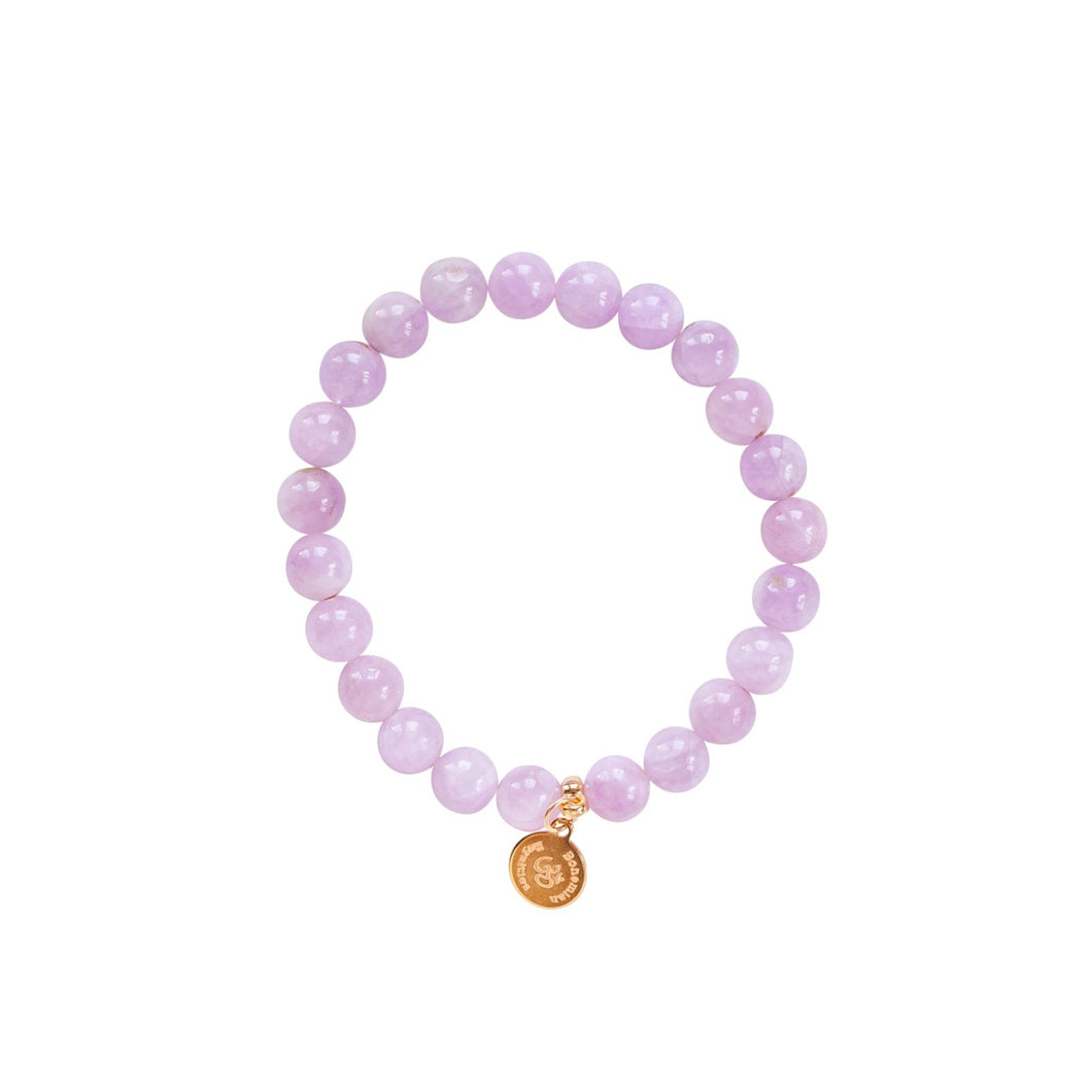 Elegant and stylish elastic Kunzite bracelet with gemstones and details in 18k gold-plated 925 sterling silver and brass. 